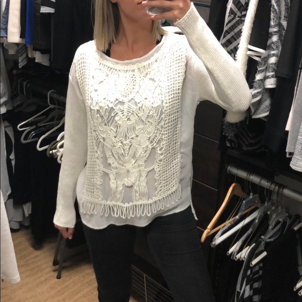 White, detailed sweater.